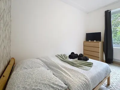 Un ou plusieurs lits dans un hébergement de l'établissement Appartement Le Paris jusqu'à 6 voyageurs