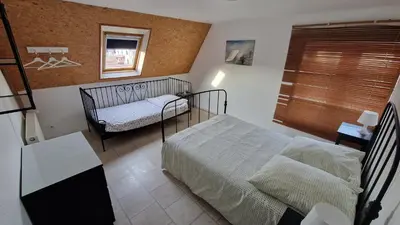 Un ou plusieurs lits dans un hébergement de l'établissement Gîte Eugénie