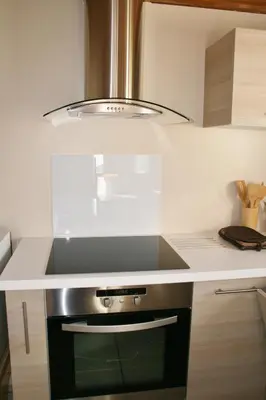 Cuisine ou kitchenette dans l'établissement Appartement Au Calme