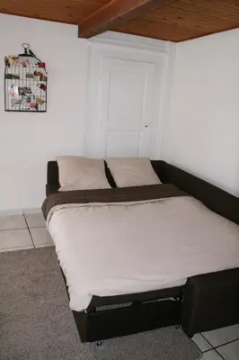 Un ou plusieurs lits dans un hébergement de l'établissement Appartement Au Calme