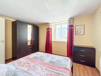 Un ou plusieurs lits dans un hébergement de l'établissement Appartement Au Calme