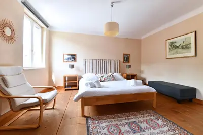 Un ou plusieurs lits dans un hébergement de l'établissement Appartement Gaspard & Lilly avec Balcon