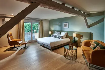 Un ou plusieurs lits dans un hébergement de l'établissement Pêche de Vigne & Spa