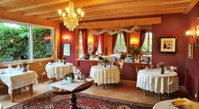 Coin salon dans l'établissement Auberge Ramstein Hôtel - Restaurant