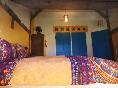 Un ou plusieurs lits dans un hébergement de l'établissement Chambre&Table d'hotes PtitMonde