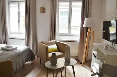 Un ou plusieurs lits dans un hébergement de l'établissement Studio Maison Verte Colmar Centre
