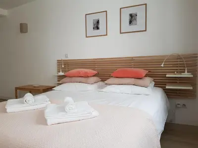 Un ou plusieurs lits dans un hébergement de l'établissement Studio Maison Verte Colmar Centre