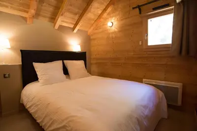Un ou plusieurs lits dans un hébergement de l'établissement Les chalets perchés
