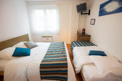 Un ou plusieurs lits dans un hébergement de l'établissement Contact Hotel Du Ladhof