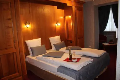 Un ou plusieurs lits dans un hébergement de l'établissement Hôtel Le Mittelwihr