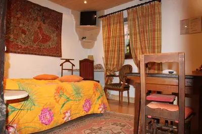 Un ou plusieurs lits dans un hébergement de l'établissement Hôtel Restaurant Le Schlossberg