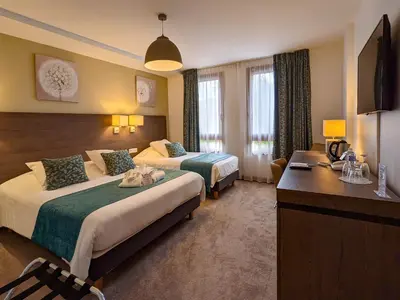 Un ou plusieurs lits dans un hébergement de l'établissement Hotel Restaurant & Spa Verte Vallée