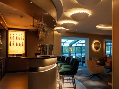 Coin salon dans l'établissement Hotel Restaurant & Spa Verte Vallée
