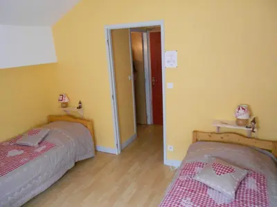 Un ou plusieurs lits dans un hébergement de l'établissement Hôtel L'Orée du Bois