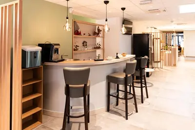 Cuisine ou kitchenette dans l'établissement Hotel Cheval De Bronze