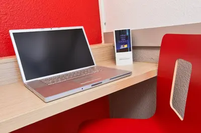 Télévision ou salle de divertissement dans l'établissement Premiere Classe Belfort