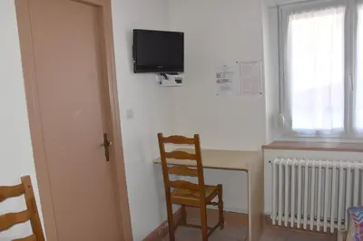 Télévision ou salle de divertissement dans l'établissement Hotel Gai Relais