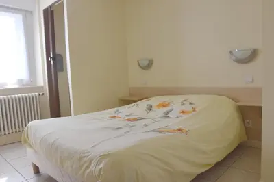 Un ou plusieurs lits dans un hébergement de l'établissement Hotel Gai Relais