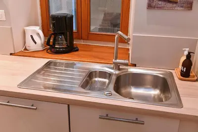 Cuisine ou kitchenette dans l'établissement Appartement Bredala avec Parking et Climatisation