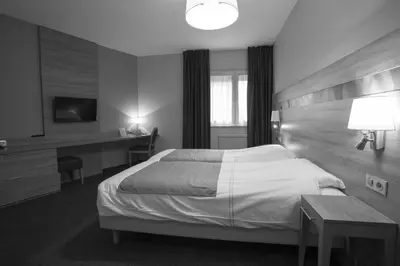 Un ou plusieurs lits dans un hébergement de l'établissement Hotel Restaurant Le Coquelicot