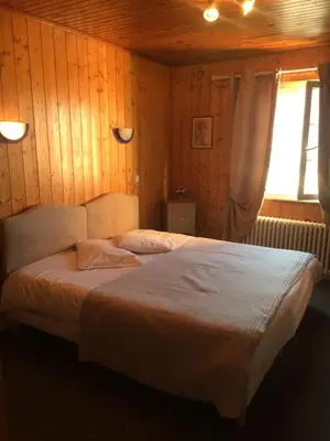 Un ou plusieurs lits dans un hébergement de l'établissement Hôtel La Vallée