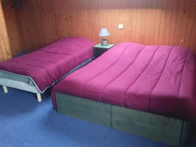 Un ou plusieurs lits dans un hébergement de l'établissement Hotel Les Sapins