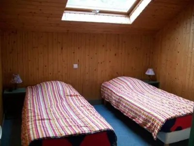Un ou plusieurs lits dans un hébergement de l'établissement Hotel Les Sapins