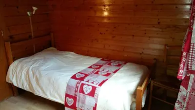 Un ou plusieurs lits dans un hébergement de l'établissement Chalet Les Jonquilles