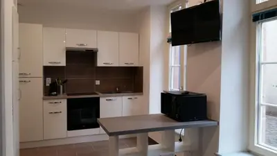 Cuisine ou kitchenette dans l'établissement Tripiers Duplex