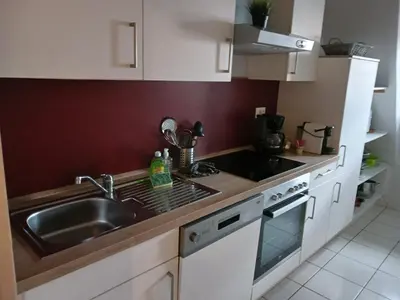 Cuisine ou kitchenette dans l'établissement Colmar City Center - Cosy Appartement BED' N' BREDALA Max
