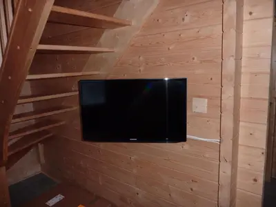 Télévision ou salle de divertissement dans l'établissement Les Noisettes