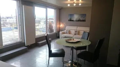 Coin salon dans l'établissement En attique - Residence le Ronsard