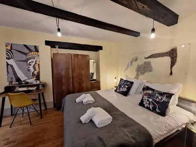 Un ou plusieurs lits dans un hébergement de l'établissement Maison Cliquot - Appartements Colmar Centre