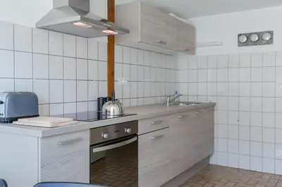 Cuisine ou kitchenette dans l'établissement Les Hauts de Colmar
