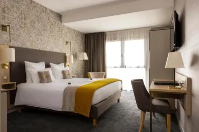 Un ou plusieurs lits dans un hébergement de l'établissement James Boutique Hôtel Colmar centre