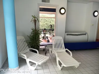 Coin salon dans l'établissement Le Repaire du Golfeur de la Largue - Mooslargue