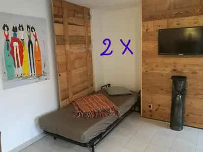 Télévision ou salle de divertissement dans l'établissement L'Appart du Vigneron
