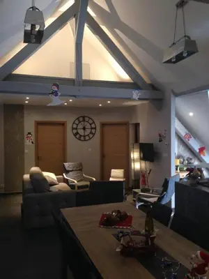 Coin salon dans l'établissement Gîte Spa Sauna Piscine CÔTÉ VERGER Merxheim Alsace