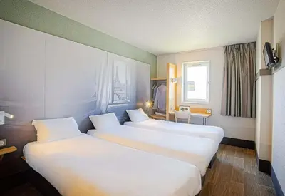 Un ou plusieurs lits dans un hébergement de l'établissement B&B HOTEL Mulhouse Ile Napoléon
