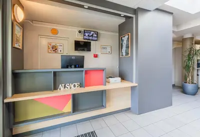 Télévision ou salle de divertissement dans l'établissement B&B HOTEL Mulhouse Ile Napoléon