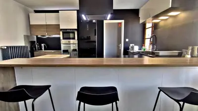 Cuisine ou kitchenette dans l'établissement Le 21