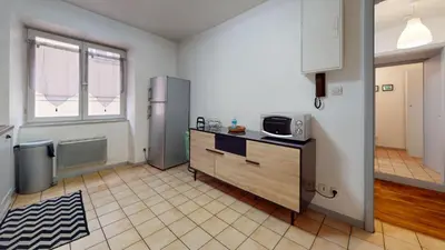 Cuisine ou kitchenette dans l'établissement Appartements Porte Neuve