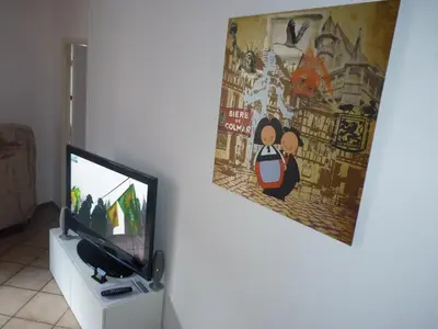Télévision ou salle de divertissement dans l'établissement Chez Mumu