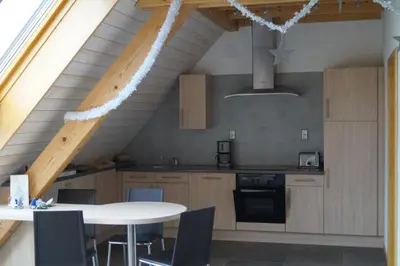 Cuisine ou kitchenette dans l'établissement Gîtes du Taennchel
