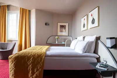 Un ou plusieurs lits dans un hébergement de l'établissement Grand Hôtel Bristol By Stay Collection
