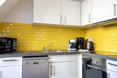 Cuisine ou kitchenette dans l'établissement Gîte 