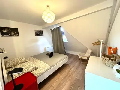 Un ou plusieurs lits dans un hébergement de l'établissement Colmar City Center - Appartement BELLE-VUE 4 étoiles