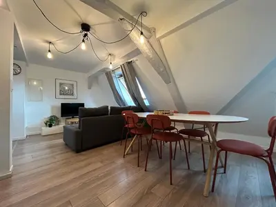 Coin salon dans l'établissement Colmar City Center - Appartement BELLE-VUE 4 étoiles