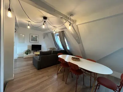 Télévision ou salle de divertissement dans l'établissement Colmar City Center - Appartement BELLE-VUE 4 étoiles
