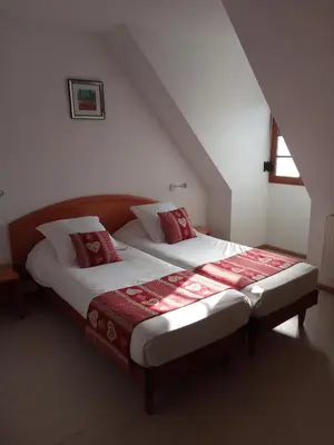 Un ou plusieurs lits dans un hébergement de l'établissement Hotel Relais d'ISSENHEIM Table d'hôtes